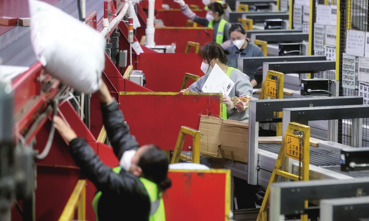 Workers sort packages at a distribution center of SF Express in Beijing on November 10, 2022. Logistics firms are fully prepared for China's annual e-commerce bonanza known as Double 11, which is right around the corner. Photo: cnsphoto