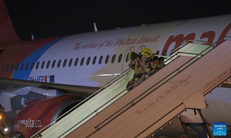 This photo taken on Nov. 8, 2022 shows the scene of an aircraft emergency exercise at the Malta International Airport in Luqa, Malta. Firefighters, medical crews and other responders got themselves busy on Tuesday night as they responded to an aircraft emergency exercise designed to test preparedness levels in case of a real-life emergency at the Malta International Airport.(Photo: Xinhua)