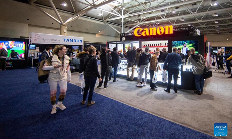 People visit the 2022 ProFusion Expo in Toronto, Canada, on Nov. 9, 2022. The two-day photography and videography event kicked off here on Wednesday in Canada and has drawn lots of imaging professionals and enthusiasts.(Photo: Xinhua)