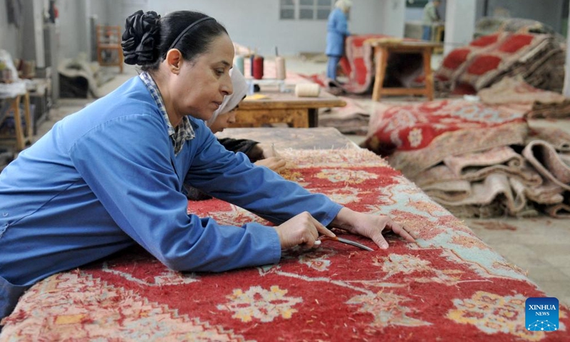 A woman works on a carpet at a workshop in Damascus, Syria, on Nov. 10, 2022.(Photo: Xinhua)