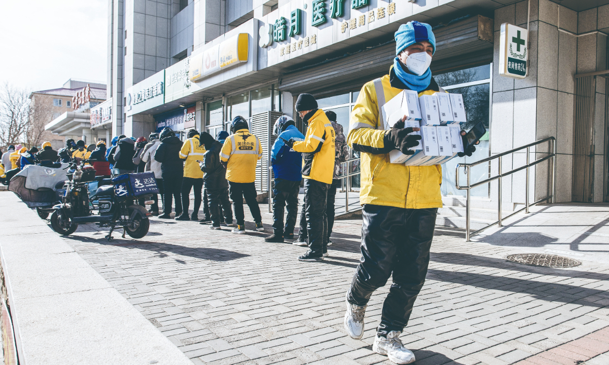 Delivery personnel dispatch COVID-19 antigen kits and medicines for fever, cold and cough as demand surges on December 8, 2022, after restrictions on drug purchases were lifted. Many pharmacies and drug producers are scrambling to ramp up supply in response. Photo: Li Hao/GT