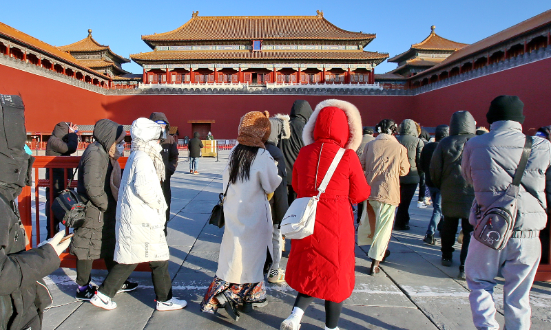 Tourists visit the Forbidden City in Beijing on December 13, 2022. Photo: VCG