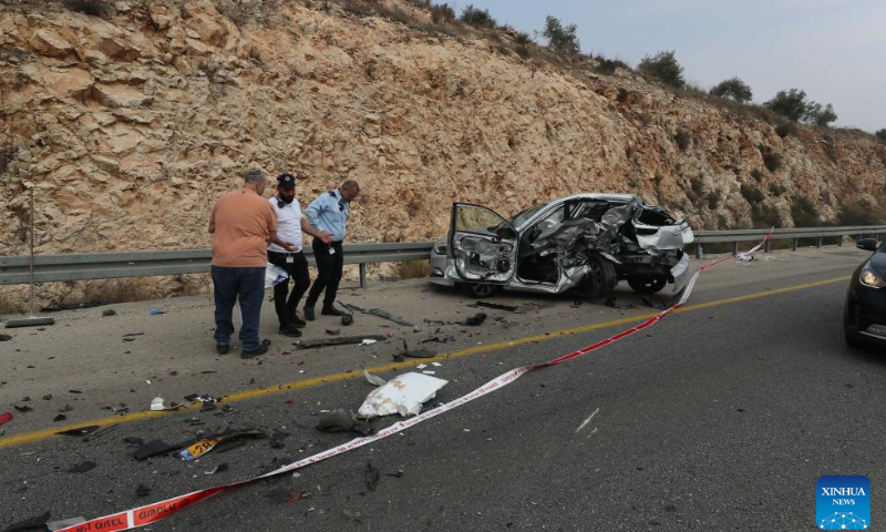 People are seen at the scene of an attack near the Israeli settlement of Ariel in the West Bank, on Nov. 15, 2022. A Palestinian man killed three Israelis and wounded three others in an attack on Tuesday in the West Bank before being shot dead by Israeli forces, Israeli military and medics said. Photo: Xinhua