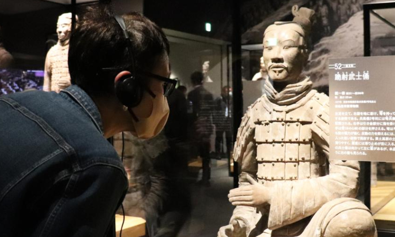 A visitor looks at an exhibit at the media preview of the exhibition Terracotta Warriors and Ancient China: Heritage from the Qin and Han Dynasty at the Ueno Royal Museum in Tokyo, Japan, on Nov. 21, 2022. In commemoration of the 50th anniversary of the normalization of China-Japan diplomatic relations, the exhibition recently opened at the Ueno Royal Museum in Tokyo, the last leg of its nearly year-long traveling exhibition in Japan.(Xinhua/Yang Guang)