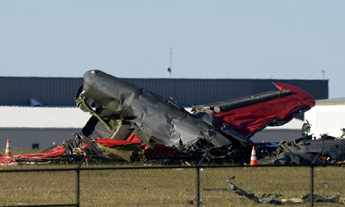 Debris from two planes that crashed during an airshow at Dallas Executive Airport are shown in Dallas on Saturday, Nov. 12, 2022.  Photo: VCG