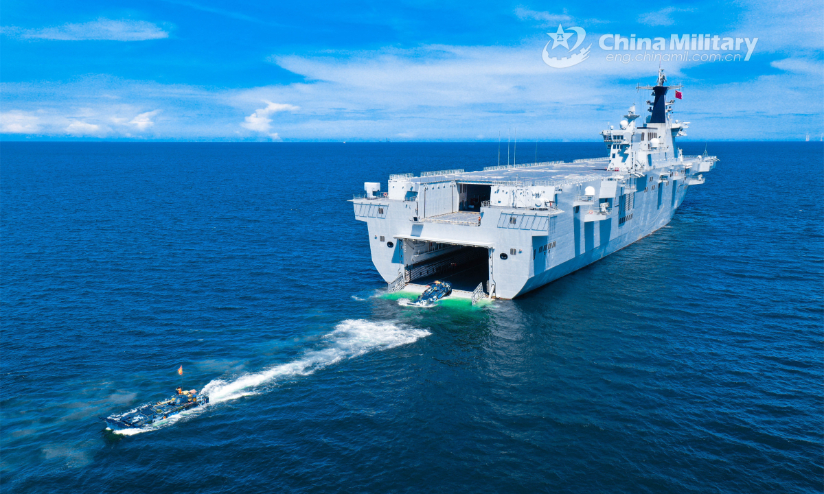 Amphibious armored vehicles attached to a brigade of the PLA Navy's Marine Corps disembark from a dock landing ship during a maritime offense and defense training exercise recently. Photo:China Military