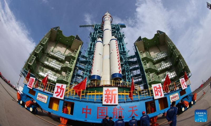 The combination of the Shenzhou-15 crewed spaceship and a Long March-2F carrier rocket is transferred to the launching area in Jiuquan Satellite Launch Center in northwest China, Nov. 21, 2022. (Photo by Li Yunxi/Xinhua)