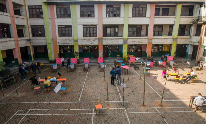 Preparations are made at a polling station ahead of the general elections in Kathmandu, Nepal, Nov. 19, 2022. (Photo by Sulav Shrestha/Xinhua)