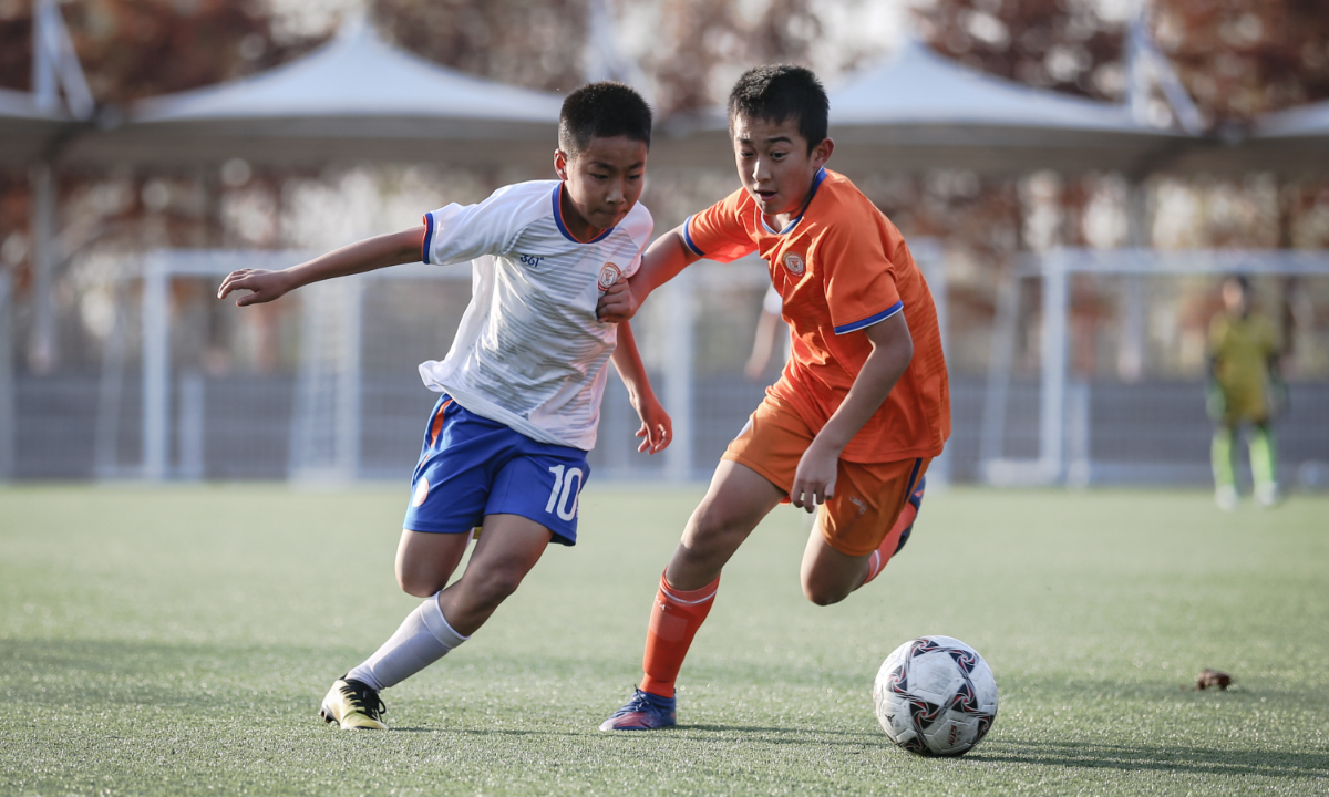 Young players during a training game in Luneng soccer school Photo: Courtesy of Shandong Taishan Football Club