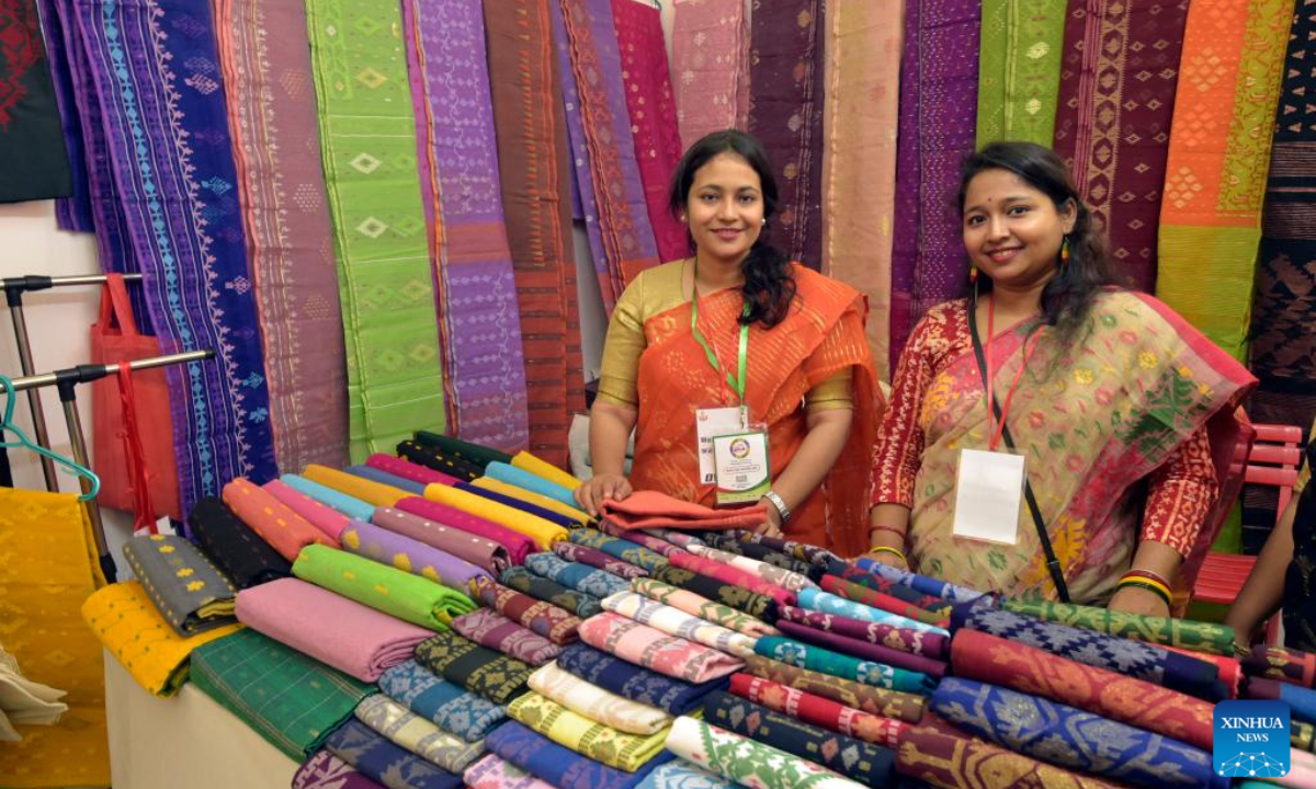 Salespersons are seen at a stall of the SME fair in the Bangabandhu International Conference Center (BICC), also known as the Bangladesh-China Friendship Conference Center, in Dhaka, Bangladesh, on Nov 24, 2022. Photo:Xinhua