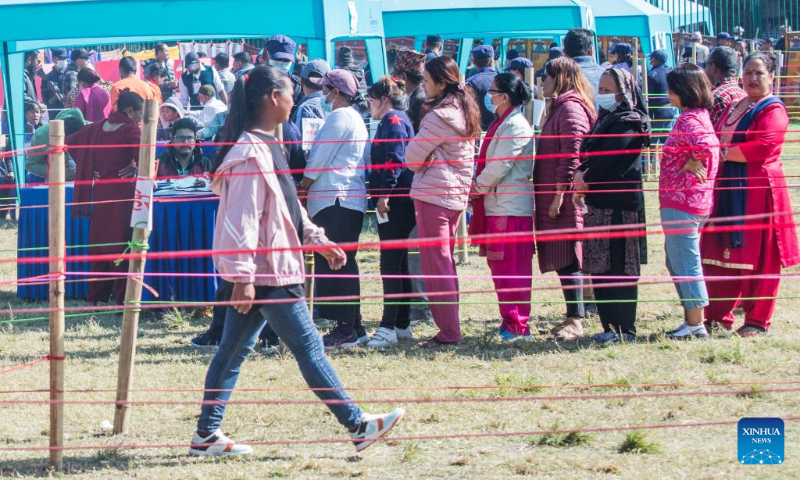 People line up to cast ballots during the general elections in Lalitpur, Nepal, Nov. 20, 2022. Nepalis went to the polls on Sunday morning for elections to the House of Representatives of the federal parliament and seven provincial assemblies. (Photo by Hari Maharjan/Xinhua)