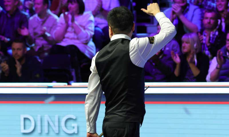 Ding Junhui of China celebrates after the semifinal match against Tom Ford of England at 2022 UK Snooker Championship in York, Britain, Nov. 19, 2022. (Photo by Zhai Zheng/Xinhua)