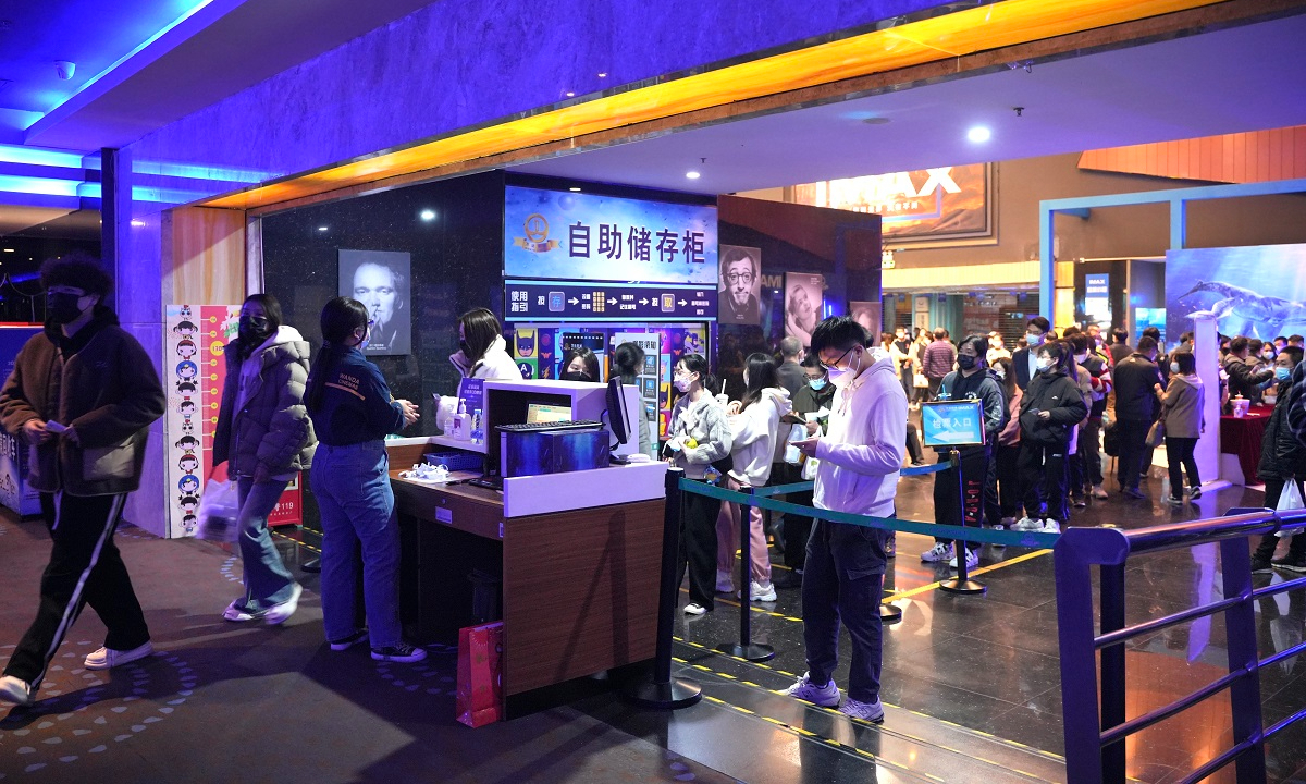 Moviegoers check in at a cinema in Dongguang, South China's Guangdong Province on December 14. Photo: VCG