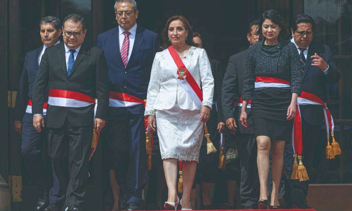 Dina Boluarte (center), interim president of Peru, arrives for a photo during the swearing-in ceremony of cabinet members at the Government Palace in Peru on December 10, 2022. The Peru’s first woman president, oversaw the ceremony in which 19 ministers – eight of whom are women – took the oath of office at the presidential palace. Photo: VCG