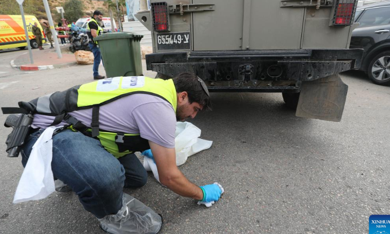 People work at the scene of an attack near the Israeli settlement of Ariel in the West Bank, on Nov. 15, 2022. A Palestinian man killed three Israelis and wounded three others in an attack on Tuesday in the West Bank before being shot dead by Israeli forces, Israeli military and medics said. Photo: Xinhua