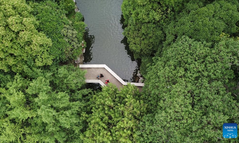This aerial photo taken on May 5, 2021 shows citizens walking at Huancheng park in Hefei City, east China's Anhui Province.
Hefei has five national wetland parks and three provincial wetland parks, with a wetland protection rate of 75 percent.
It was accredited on Nov. 10, 2022 by the Ramsar Convention as an international wetland city. (Xinhua/Zhang Duan)