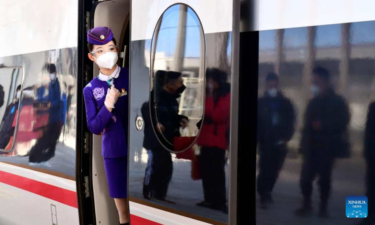 A stewardess is seen at Xueye railway station of Jinan-Laiwu intra-city high-speed railway in east China's Shandong Province, Dec 30, 2022. Photo:Xinhua