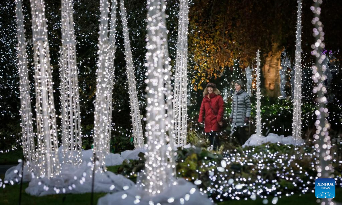 People look at the light decorations at the VanDusen Botanical Garden in Vancouver, British Columbia, Canada, Nov. 25, 2022. Featuring over a million lights in the 6.07-hectare VanDusen Botanical Garden, the 