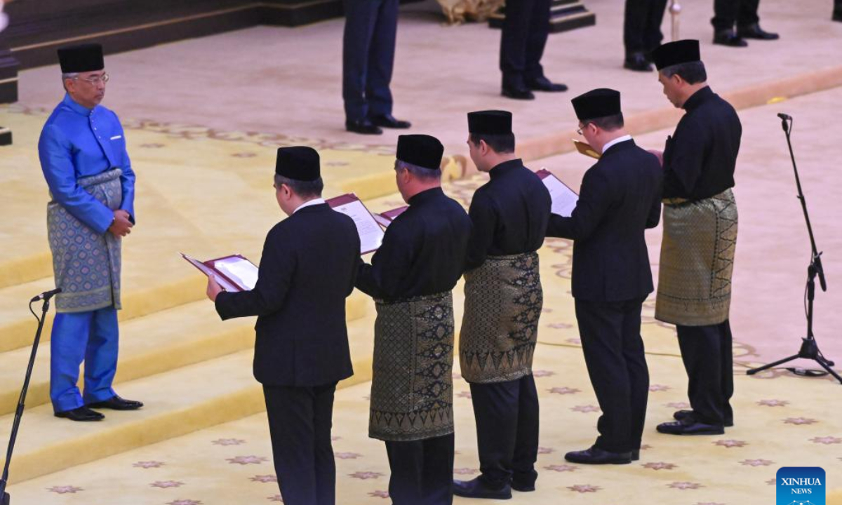 Malaysian new cabinet ministers are sworn in before Malaysian King Sultan Abdullah Sultan Ahmad Shah (1st, L) in Kuala Lumpur, Malaysia, Dec. 3, 2022. Malaysian cabinet ministers appointed to their portfolios were sworn in on Saturday, allowing them to officially assume their duties.

In a televised ceremony, they took their oaths of office in front of Malaysian King Sultan Abdullah Sultan Ahmad Shah, who also presented them with the documents of their appointment. (Malaysia's Department of Information/Handout via Xinhua)