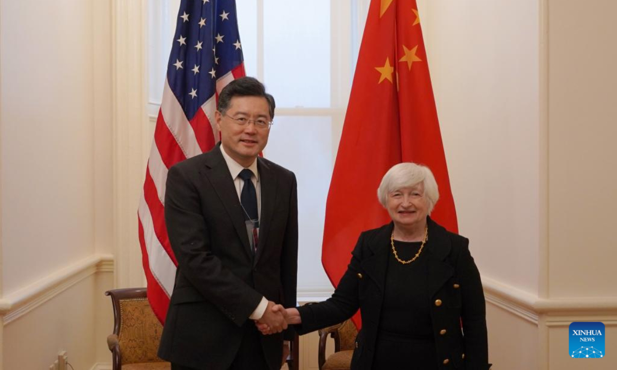 Chinese Ambassador to the United States Qin Gang (L) shakes hands with US Secretary of the Treasury Janet Yellen during their meeting in Washington, DC, the United States, on Dec 15, 2022. Photo:Xinhua