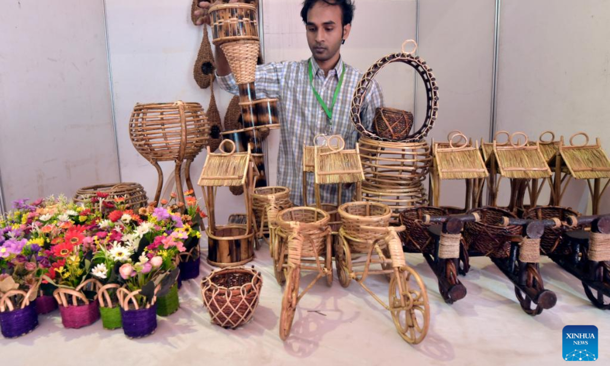 A salesperson shows products at a stall of the SME fair in the Bangabandhu International Conference Center (BICC), also known as the Bangladesh-China Friendship Conference Center, in Dhaka, Bangladesh, on Nov 24, 2022. Photo:Xinhua
