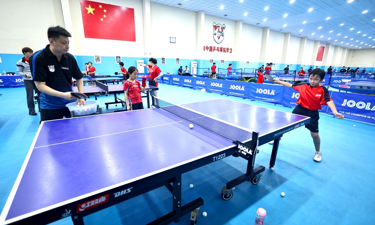 Children train at the Shandong?Luneng Table Tennis?Club in Jinan, East China's Shandong Province. Photo: VCG