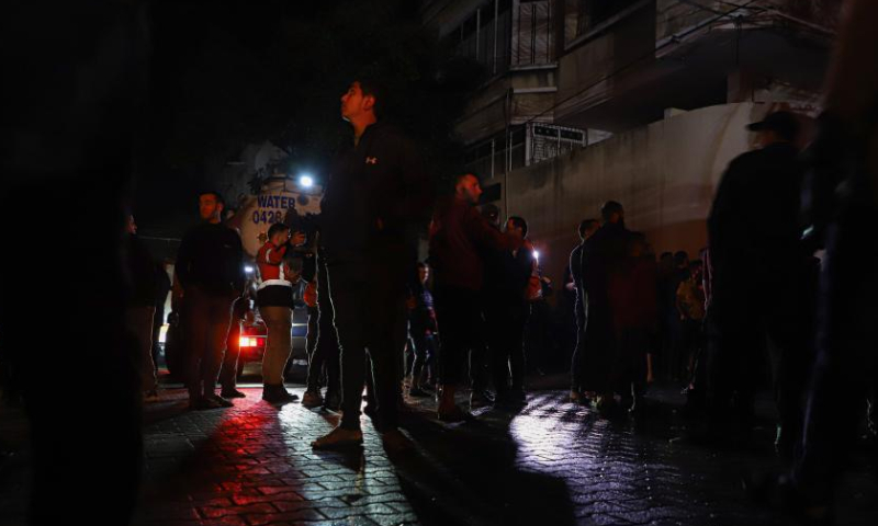 People gather around the scene of a massive fire in Jabalia refugee camp in the northern Gaza Strip, on Nov. 17, 2022. At least 21 Palestinians, including seven children, were killed and more than 30 others were injured on Thursday in a massive fire inside a residential building in the northern Gaza Strip, said security and medical sources. Photo: Xinhua