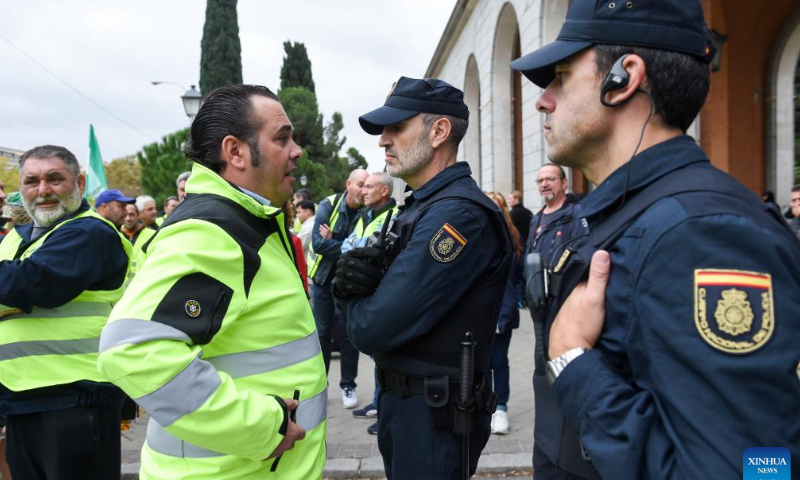 Truck drivers take part in a protest in Madrid, Spain, on Nov. 14, 2022. Truck drivers in Spain began an indefinite strike on Monday against the rising cost of living. Back in March and April, the country's truckers staged a 20-day strike, which caused major problems in the national supply chains. Photo: Xinhua