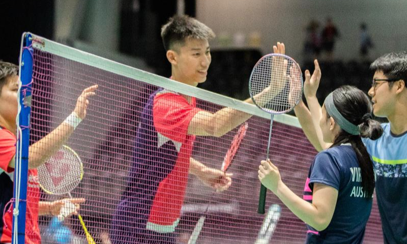 Feng Yanzhe (2nd L)/Huang Dongping (1st L) of China greet Pitchaya Elysia Viravong (2nd R)/Xing Huong Goh of Australia after their mixed doubles first round match at the Australian Open 2022 badminton tournament in Sydney, Australia, Nov. 15, 2022. Photo: Xinhua