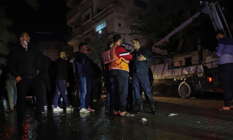 People gather around the scene of a massive fire in Jabalia refugee camp in the northern Gaza Strip, on Nov. 17, 2022. At least 21 Palestinians, including seven children, were killed and more than 30 others were injured on Thursday in a massive fire inside a residential building in the northern Gaza Strip, said security and medical sources. Photo: Xinhua