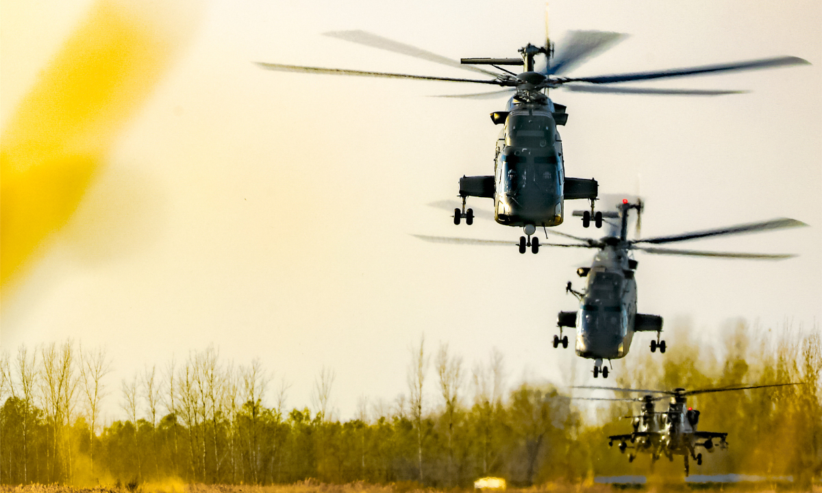 Multiple types of helicopters attached to an army aviation brigade under the PLA 80th Group Army lift off for a routine flight training exercise recently. Photo:China Military