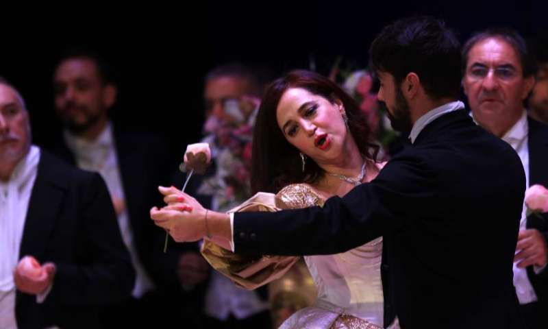 Soprano Zeina Barhoum (C) performs in the opera La Traviata during the 2022 Amman Opera Festival in Amman, Jordan, on Nov. 18, 2022. (Photo by Mohammad Abu Ghosh/Xinhua)
