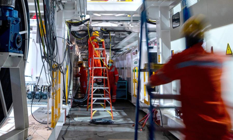 Employees work at a workshop of China Railway Engineering Equipment Group Co., Ltd. (CREG) in Zhengzhou, central China's Henan Province, Nov. 23, 2022. Tunnel boring machines made by CREG have been exported to more than 30 countries and regions for major projects, which are actively serving tunnel construction projects globally. (Xinhua)
