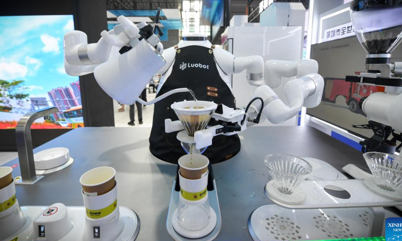 A robot makes coffee at the 24th China Hi-Tech Fair (CHTF) in Shenzhen, south China's Guangdong Province, Nov. 15, 2022. The 24th China Hi-Tech Fair (CHTF) kicked off on Tuesday in Shenzhen, south China's Guangdong Province, attracting over 5,600 exhibitors from 41 countries and regions. Photo: Xinhua