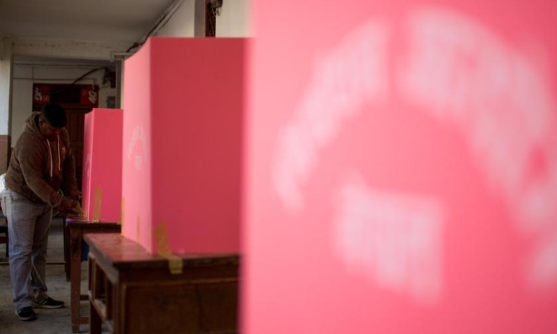 Preparations are made at a polling station ahead of the general elections in Kathmandu, Nepal, Nov. 19, 2022. (Photo by Sulav Shrestha/Xinhua)