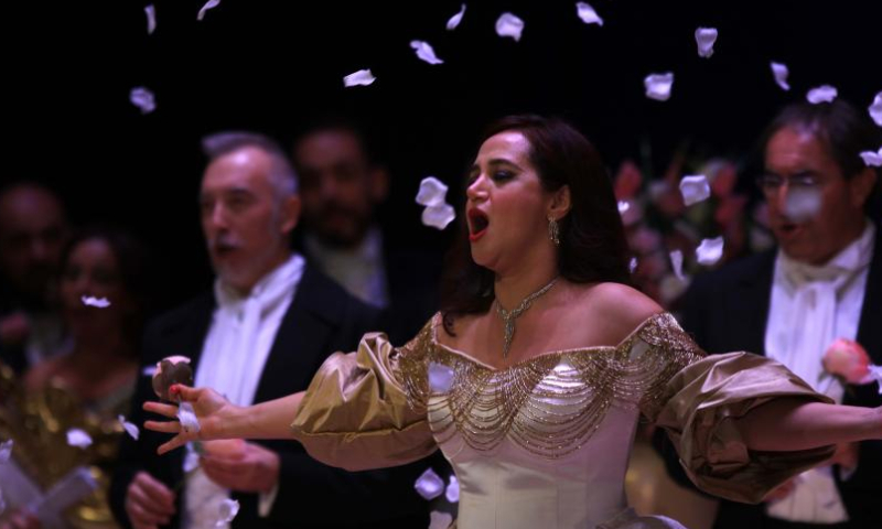Soprano Zeina Barhoum (Front) performs in the opera La Traviata during the 2022 Amman Opera Festival in Amman, Jordan, on Nov. 18, 2022. (Photo by Mohammad Abu Ghosh/Xinhua)