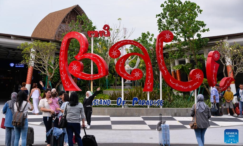 People are seen at an exit of Bali Denpasar Ngurah Rai International Airport in Bali, a famous tourist destination of Indonesia, Nov. 9, 2022. (Xinhua/Xu Qin)