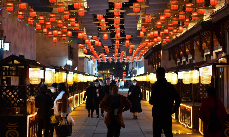 People visit the Hongjiang ancient town in Huaihua, central China's Hunan Province, Dec. 9, 2022. Hongjiang ancient town has launched a variety of activities at nighttime to boost night economy. (Xinhua/Chen Zhenhai)