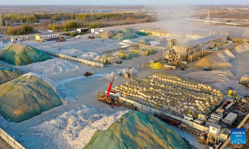 This photo taken on Nov. 11, 2022 shows the production site of a cotton company in Xayar County, northwest China's Xinjiang Uygur Autonomous Region. The cotton harvest is drawing to an end in Xayar County, a premium-quality cotton production base of China. As of Friday, 1.706 million mu (about 113,733 hectares) of cotton has been harvested here. (Photo by Liu Yuzhu/Xinhua)