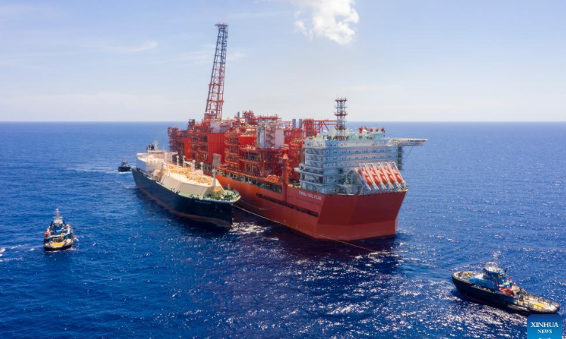 This aerial photo taken on Nov. 11, 2022 shows an oil tanker British Sponsor (L) loading Liquefied Natural Gas (LNG) alongside the Coral South Floating Liquefied Natural Gas (FLNG) platform in northeastern Mozambique. Photo: Xinhua