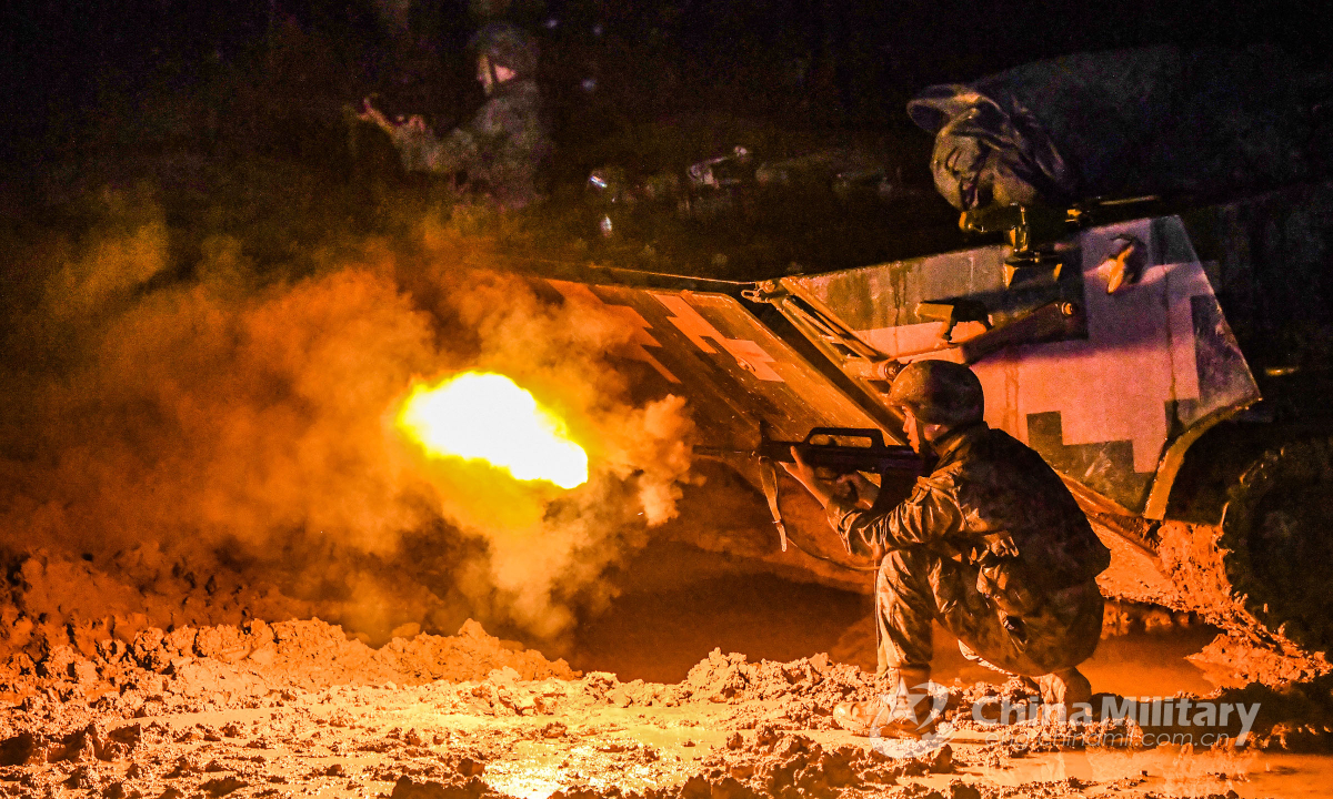 Soldiers assigned to a brigade under the PLA 73rd Group Army fire at mock enemy at night in real-combat training on November 16, 2022. Photo: China Military