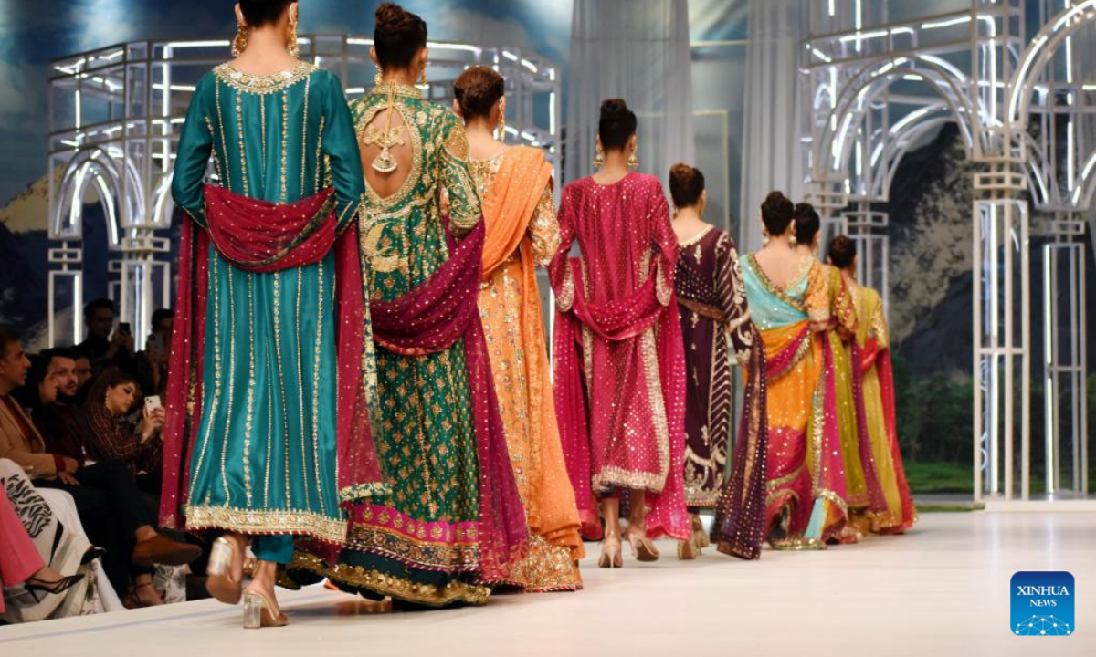 Models present creations during the Bridal Couture Week in Lahore, Pakistan on Dec 16, 2022. Photo:Xinhua