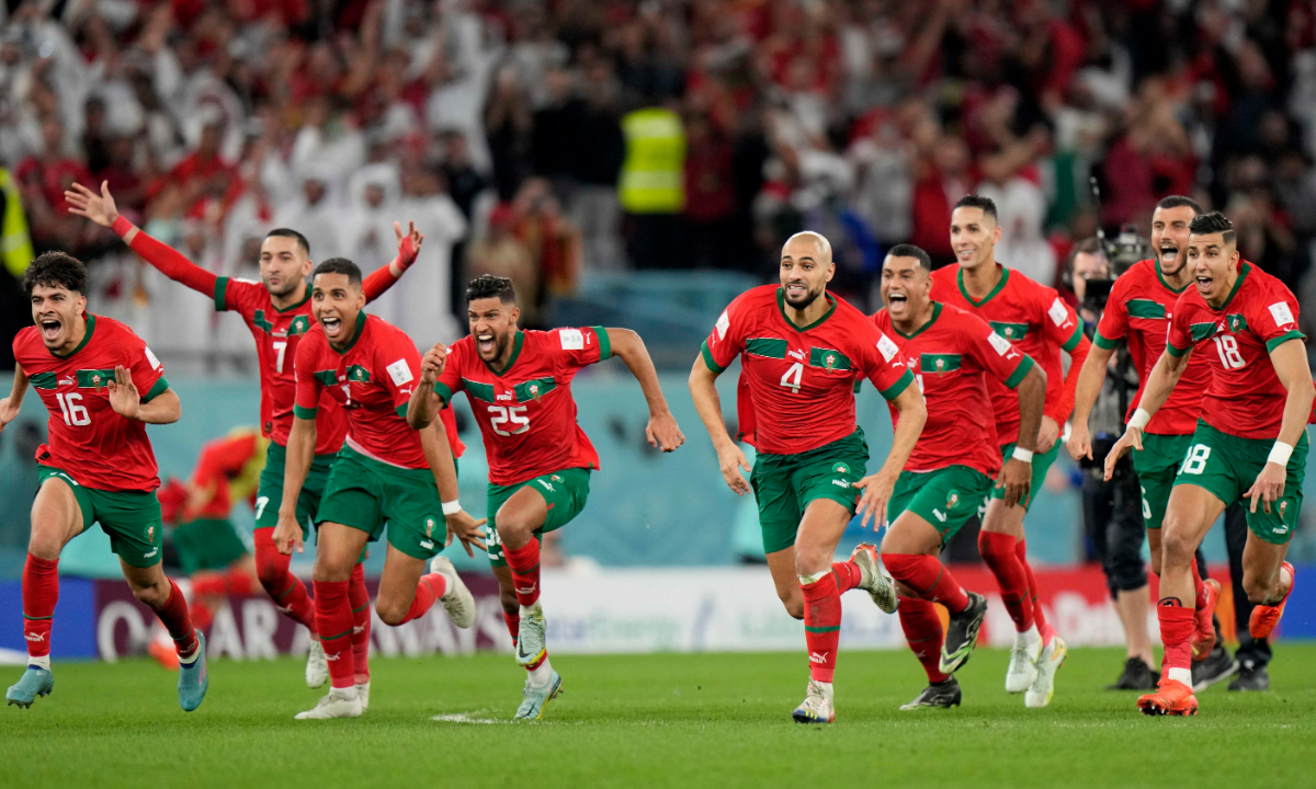 Morocco celebrate after the team’s victory in the penalty shoot out during the Qatar World Cup 2022 round of 16 match in Al Rayyan, Qatar on December 6, 2022. Photo: VCG