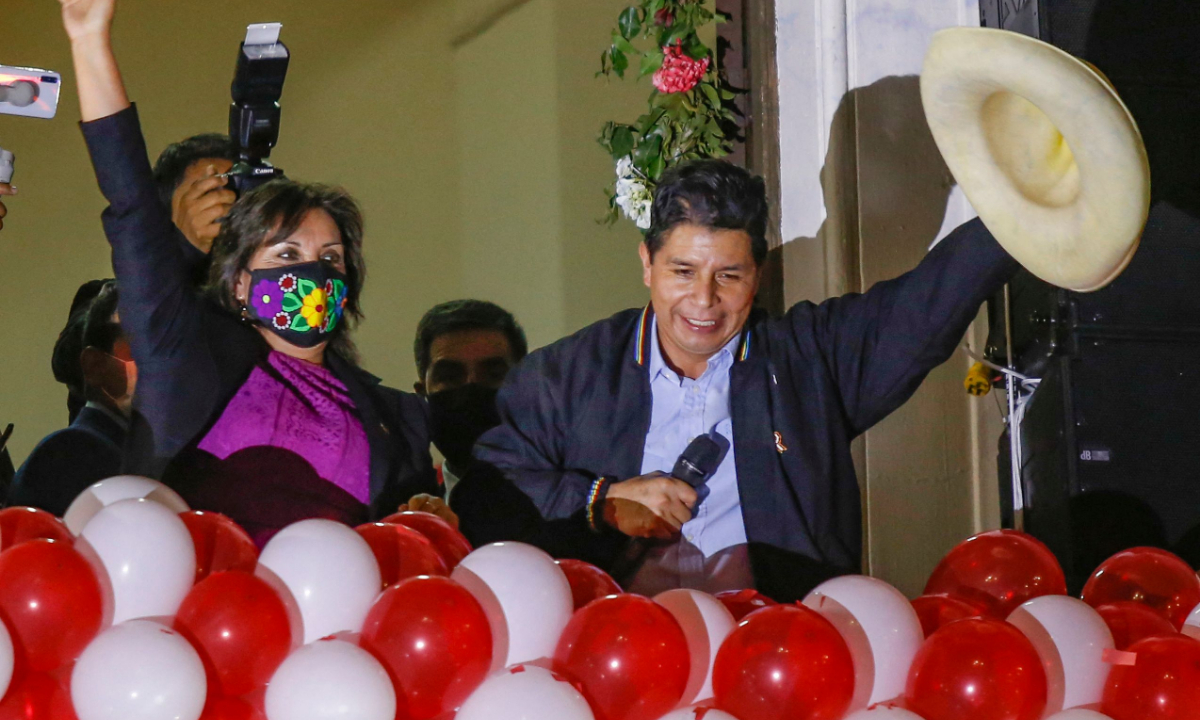 Elected Peruvian President Pedro Castillo (R) and Vice-President Dina Boluarte greet their supporters during a celebration at the Peru Libre headquarters, following the ceremony in which their received their credentials for the 2021-2026 period in Lima, on July 23, 2021. Photo: VCG