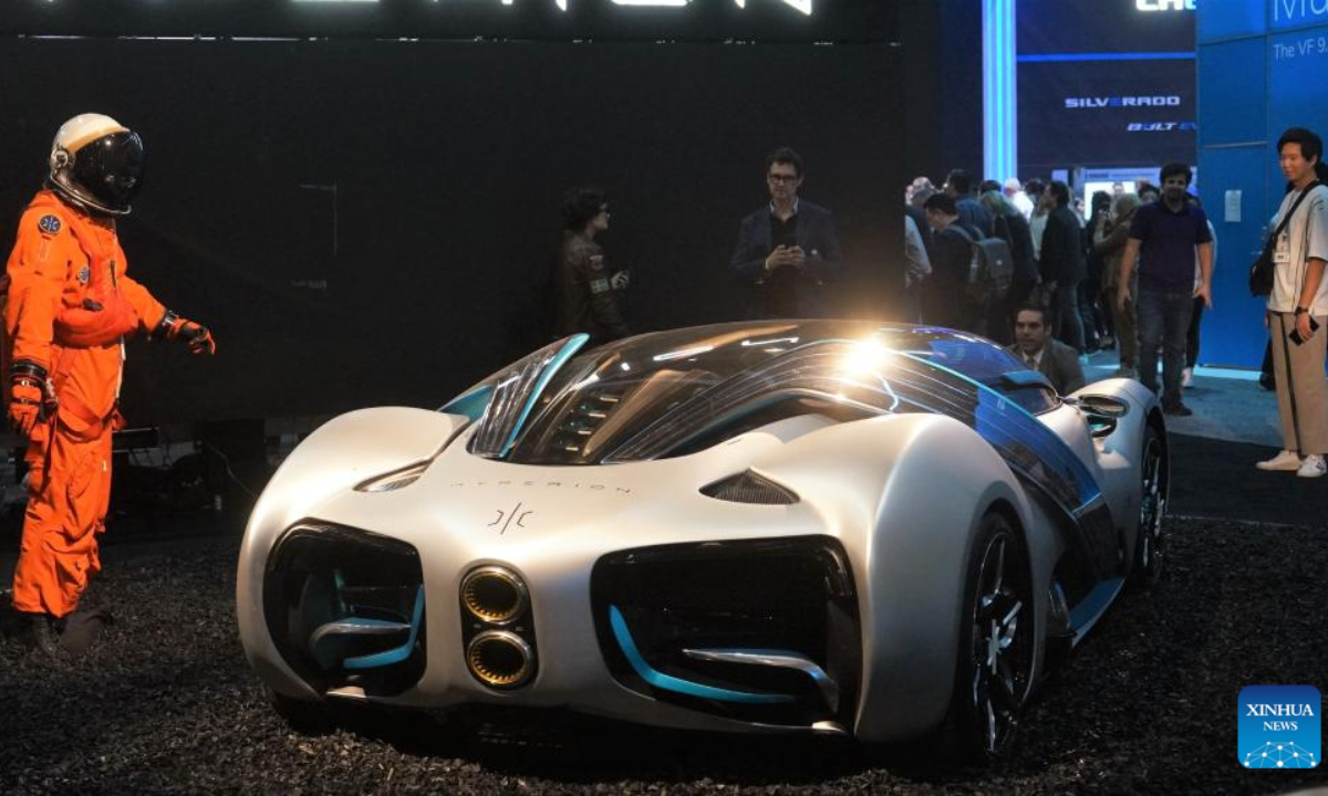 Visitors look at a new energy hypercar during a media preview at the 2022 Los Angeles Auto Show in Los Angeles, the United States, Nov 17, 2022. The auto show will open to the public from Friday until Nov 27. Photo:Xinhua