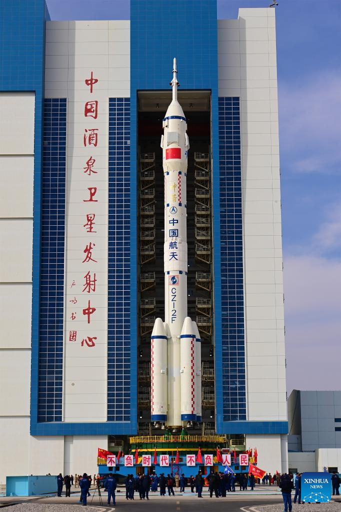 The combination of the Shenzhou-15 crewed spaceship and a Long March-2F carrier rocket is transferred to the launching area in Jiuquan Satellite Launch Center in northwest China, Nov. 21, 2022. (Photo by Li Yunxi/Xinhua)