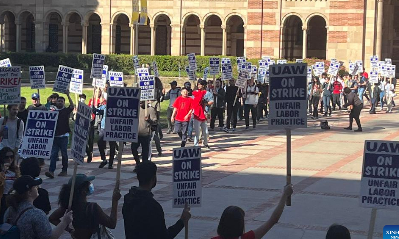 People take part in a protest on campus of the University of California, Los Angeles (UCLA) in Los Angeles, California, the United States, on Nov. 14. 2022. Tens of thousands of academic workers at the University of California (UC) system went on strike Monday for higher wages and better working conditions. Photo: Xinhua