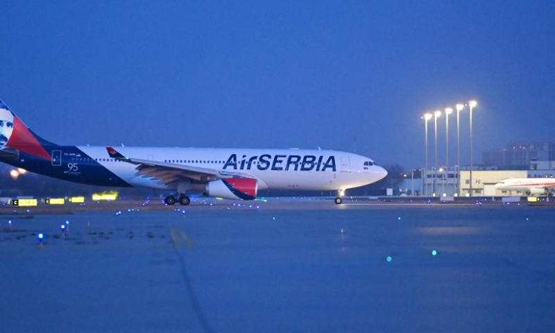 Flight JU702 decorated with the portrait of Nikola Tesla taxis after landing at Tianjin Binhai International Airport in north China's Tianjin, Dec. 10, 2022. The flight carrying about 170 passengers landed at Tianjin Binhai International Airport on Saturday, marking the official opening of the direct flight between Serbia's Belgrade and north China's Tianjin city.

Flights operated by Serbia's national carrier Air Serbia, will run once a week. (Xinhua/Li Ran)

