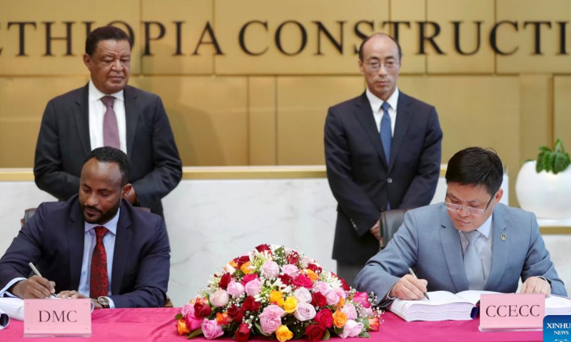 Representatives of China Civil Engineering Construction Corporation (CCECC) and DMC Trading Private Limited Company sign an agreement in Addis Ababa, Ethiopia, Nov. 12, 2022. Photo: Xinhua