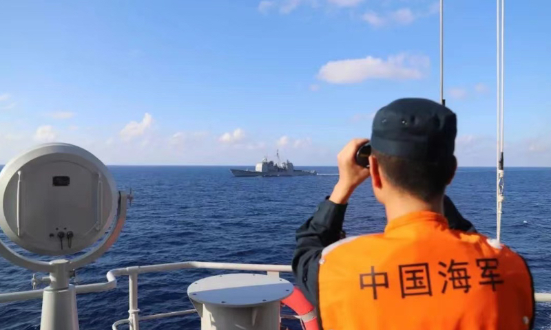 Main: A photo released on November 29, 2022 by the PLA Southern Theater Command shows a Chinese soldier watching the trespassing USS Chancellorsville. Photo: Courtesy of PLA Southern Theater Command